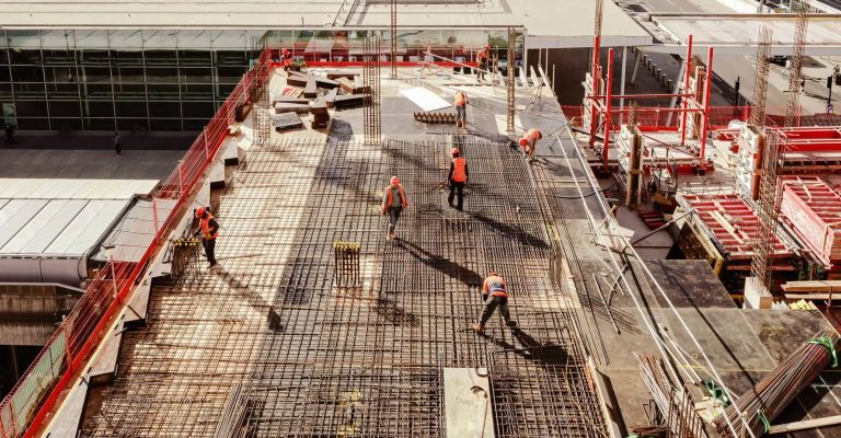 workers laying foundation for concrete