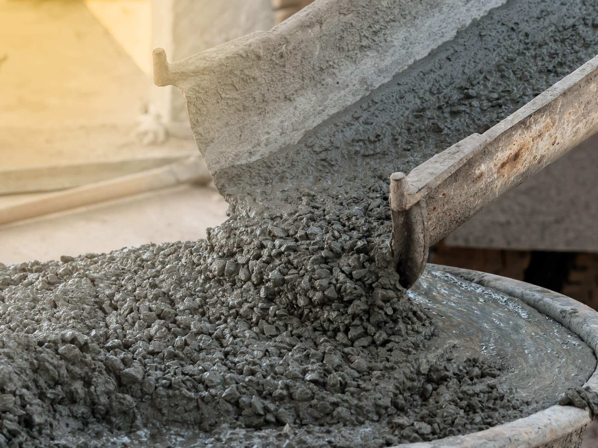 concrete being poured by a machine