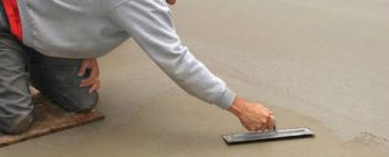 worker leveling concrete