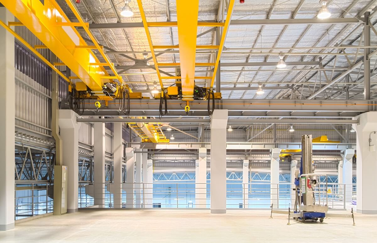 inside of a warehouse with yellow beams