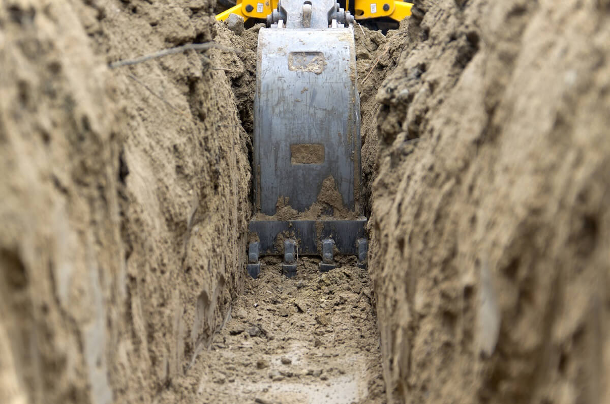 excavation being performed in the mud