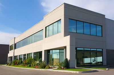 grey building with blue reflective windows