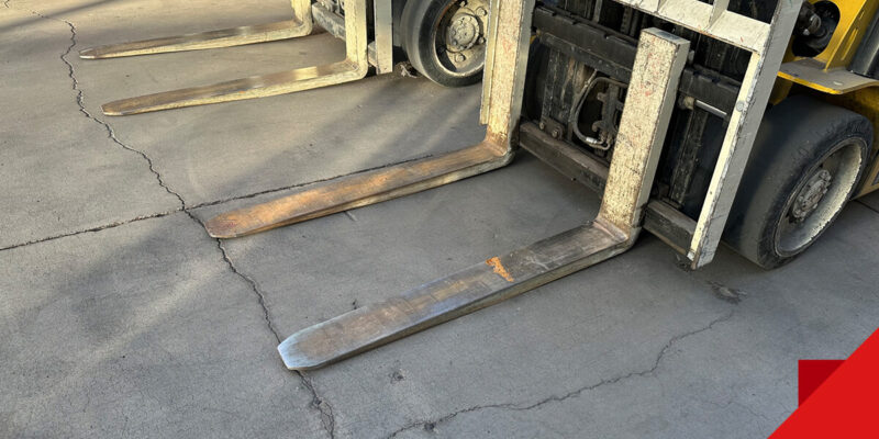 forklift on top of cracked concrete